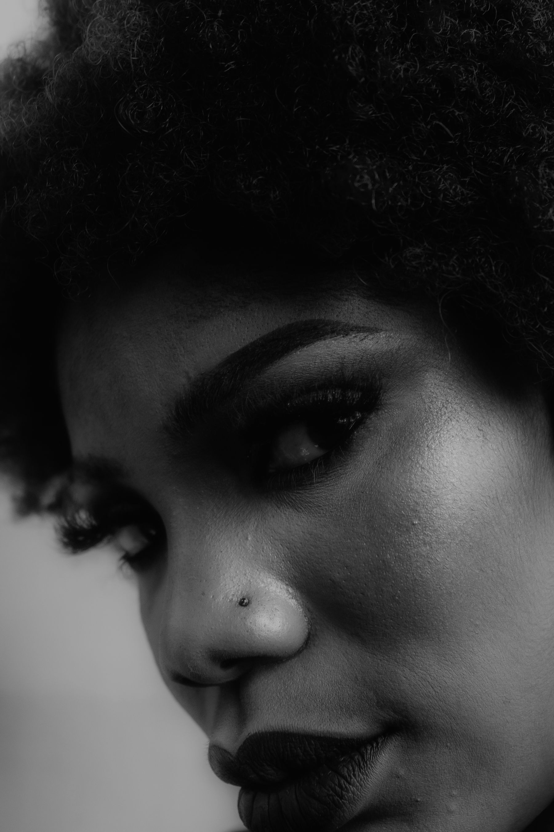 Black and white portrait of a woman with natural hair